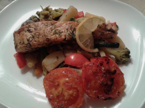 Dill stuffed salmon fillet served with veg and pan-fried tomatoes